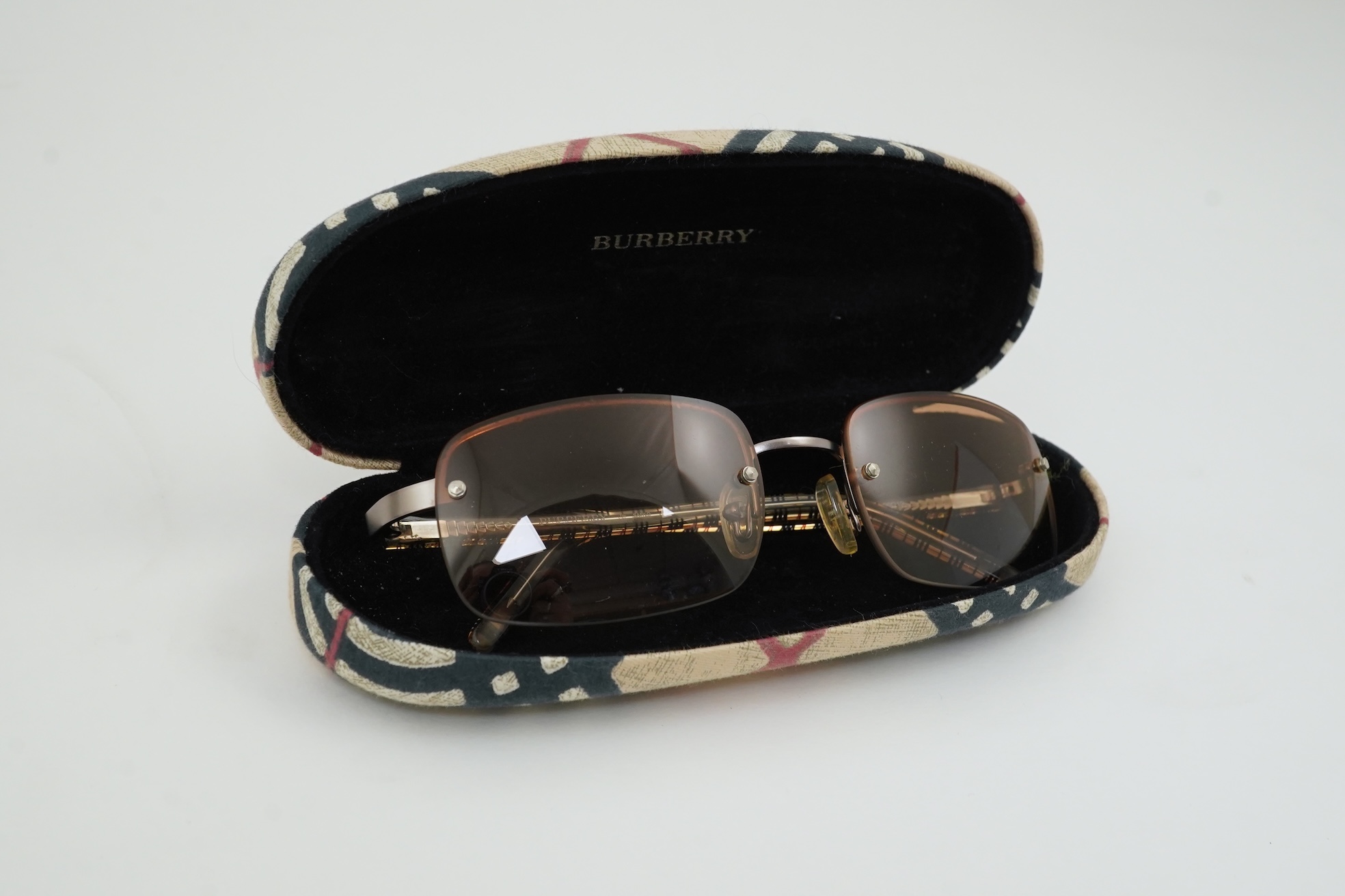 A Burberry brown tartan scarf, sunglasses with case and wallet with original box.